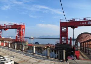 a view of the ocean with a red crane at Komecho Ryokan / Vacation STAY 36247 in Imabari