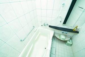 a white bathroom with a toilet and a mirror at Hashima - Hotel - Vacation STAY 52732v in Hashima +8 photos