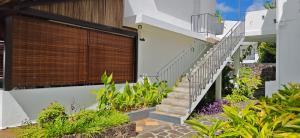 a staircase leading up to a house with plants at Résidences Le Beau Manguier in Pereybere +10 photos