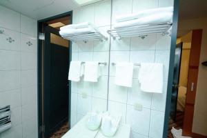 a bathroom with white towels hanging on a wall at Hashima - Hotel - Vacation STAY 50945v in Hashima +9 photos