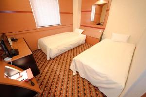 a small room with two beds and a mirror at Hashima - Hotel - Vacation STAY 50945v in Hashima