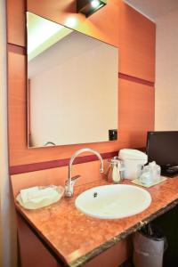 a bathroom counter with a sink and a mirror at Hashima - Hotel - Vacation STAY 51161v in Hashima +7 photos
