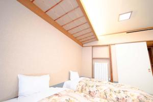 a bedroom with two beds and a window at Hashima - Hotel - Vacation STAY 52664v in Hashima