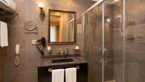 a bathroom with a shower and a sink and a glass shower at Elite World Nest Van in Van +31 photos