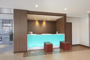 a lobby with a blue counter in a building at Hotel Sun Clover Koshigaya Station - Vacation STAY 55366 in Koshigaya