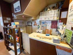 a shop with a counter and a counter top at Guesthouse Otaru Wanokaze women's domitory / Vacation STAY 32191 in Otaru