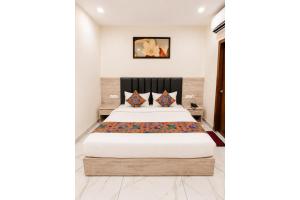 a bedroom with a bed in a room at FabHotel K9 Regency in Zirakpur