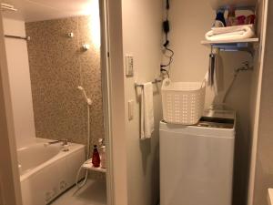 a bathroom with a tub and a sink and a shower at Time - Vacation STAY 18884v in Kagoshima
