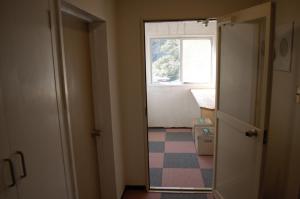 an empty room with a window and a door with a hallway at Amami - Vacation STAY 83858 in Katsuura