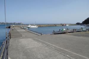a dock with boats in a body of water at Amami - Vacation STAY 83858 in Katsuura