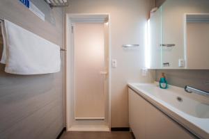 a bathroom with a sink and a mirror at winco - Vacation STAY 05557v in Tokyo