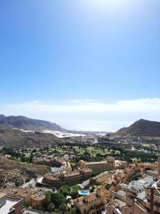 a view of a city with mountains in the background at Apartamento Playaluna in Almería