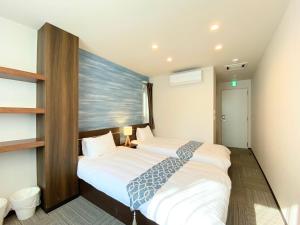 a bedroom with two beds in a room at winco - Vacation STAY 05545v in Tokyo