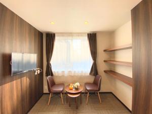 a room with a table and two chairs and a window at winco - Vacation STAY 05545v in Tokyo +9 photos