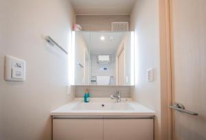 a bathroom with a sink and a mirror at winco - Vacation STAY 05545v in Tokyo