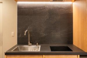 a kitchen with a sink and a counter top at winco - Vacation STAY 06660v in Tokyo +46 photos