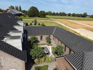 an overhead view of roofs of a house at Ferienwohnung Lindenglück in Uedem