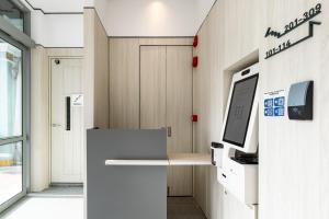 an office with a desk with a computer on it at Heritage Collection on KG - Mobile App Check-In in Singapore +23 photos