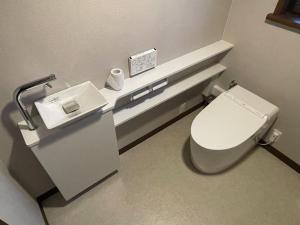 a bathroom with a toilet and a sink at Hakusyu - Vacation STAY 11460v in Aso +31 photos