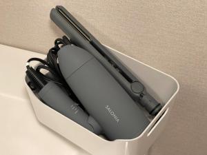a computer mouse in a container on a table at Hakusyu - Vacation STAY 11460v in Aso