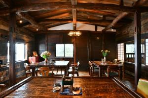 a dining room with wooden tables and chairs at Cominka - Vacation STAY 30137v in Chino +32 photos
