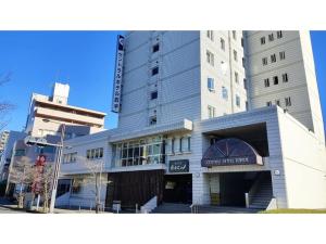 a building with a sign on the front of it at Central Hotel Toride - Vacation STAY 09922v in Toride