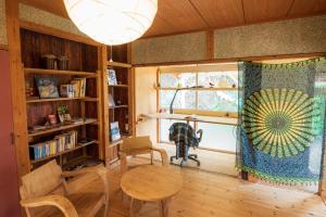 a living room with a table and a window at Hide A Way - Vacation STAY 90104v in Nishinoomote