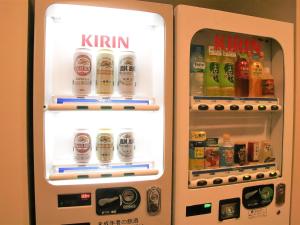 an open refrigerator with drinks in it at Anan Station Hotel - Vacation STAY 11048v in Anan