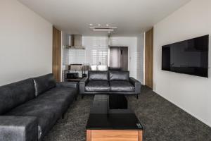 a living room with a couch and a tv at Hotel Dios - Vacation STAY 31184v in Awaji +20 photos