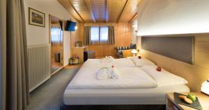 Postel nebo postele na pokoji v ubytování Hotel La Perla