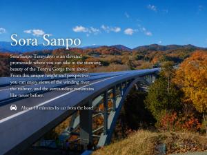 a picture of a bridge in the mountains at Yoshinotei in Iida