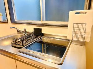 a kitchen counter with a sink and a stove at CONNECT, - Vacation STAY 81699v in Arita