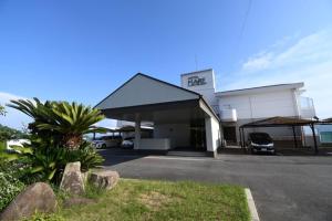 a building with a car parked in front of it at Hotel Mare - Vacation STAY 96730v in Kure