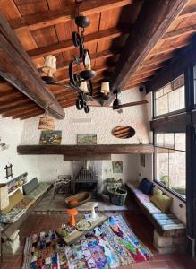 a living room with a couch and a fireplace at Maison malouna in Saint-Thibéry