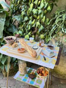 a table with bread and other food on it at Maison malouna in Saint-Thibéry +29 photos