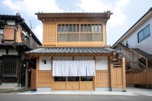a building with a window and a white curtain at Nagi - Vacation STAY 55367v in Katori