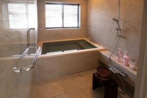 a bathroom with a shower and a bath tub at Nagi - Vacation STAY 55367v in Katori