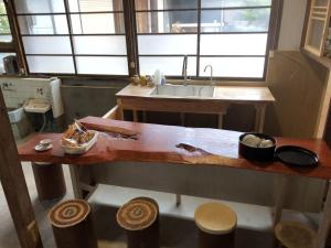 a kitchen with a sink and a wooden counter top at Setouchi base - Vacation STAY 48109v in Mitoyo +18 photos