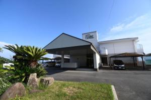 a building with a car parked in front of it at Hotel Mare - Vacation STAY 58102v in Kure