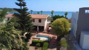 a view of a house with a swimming pool at Villa Sunrise in Casteldaccia