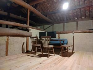 a table and chairs in a room with a blue table at Setouchi base - Vacation STAY 48143v in Mitoyo +1 photo