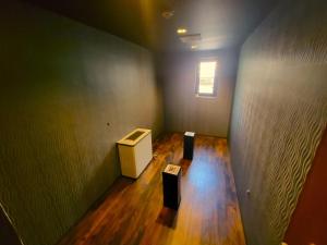 a small room with a table and a window at HOTEL SEAGULL - Vacation STAY 36269v in Izumi-Sano