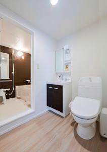 a bathroom with a toilet and a sink and a shower at Class Besso Ise - Vacation STAY 15745v in Iseji