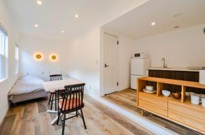 a kitchen and a bedroom with a table and a bed at Class Besso Ise - Vacation STAY 15745v in Iseji