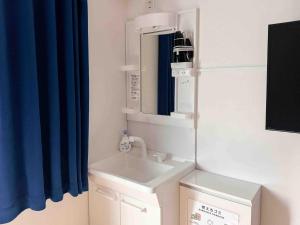 a bathroom with a sink and a mirror at D Hotel - Vacation STAY 14103v in Tokyo +30 photos