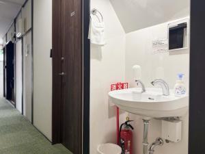 a bathroom with a sink and a toilet at D Hotel - Vacation STAY 89642v in Tokyo +22 photos