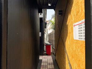an alley with a sign on the side of a building at D Hotel - Vacation STAY 89642v in Tokyo