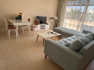 a living room with a couch and a table at Elgouna Hurghada egypt mangroovy in Hurghada