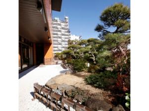 a garden on the side of a building at Central Hotel - Vacation STAY 99764v in Kusugaurachō
