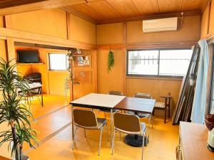a dining room with a table and chairs at kupono - Vacation STAY 00641v in Minamiboso +32 photos